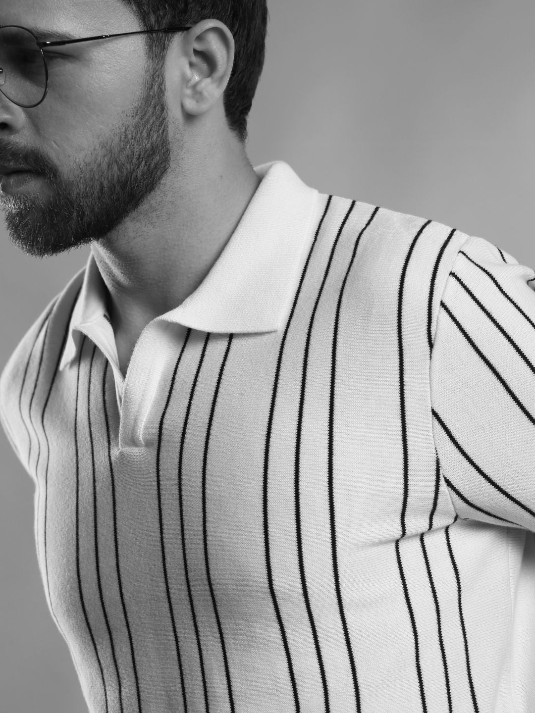 guy wearing a striped polo t-shirt