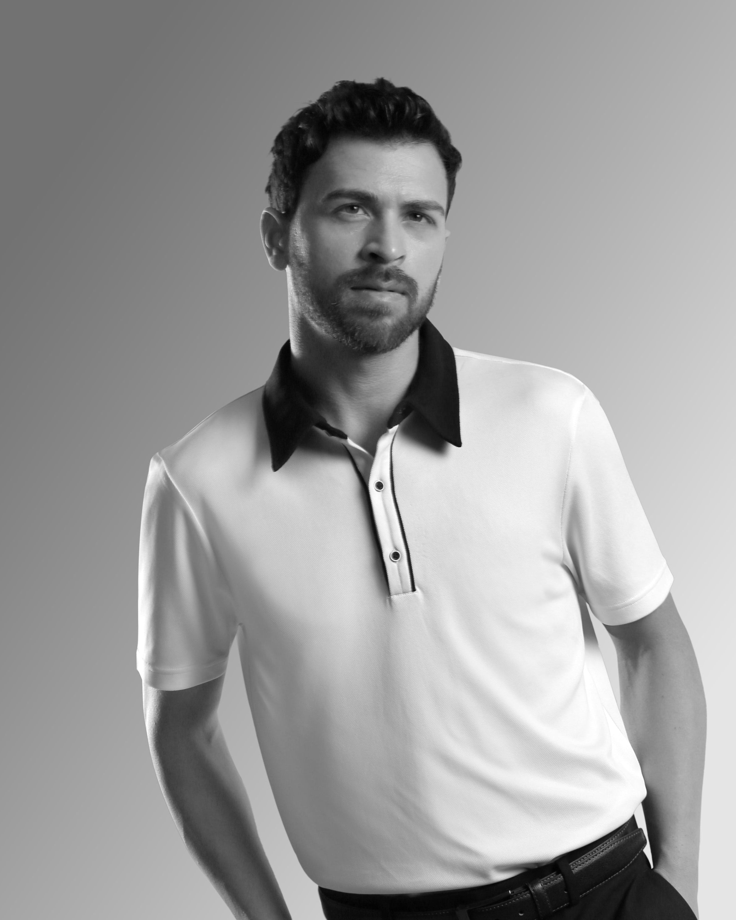 man wearing a white polo t-shirt with black collar