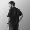 THE TEXTURED HALF-SLEEVE FLAT-KNIT BLACK SHIRT