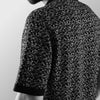 THE CHEVRON HALF-SLEEVE FLAT-KNIT BLACK SHIRT