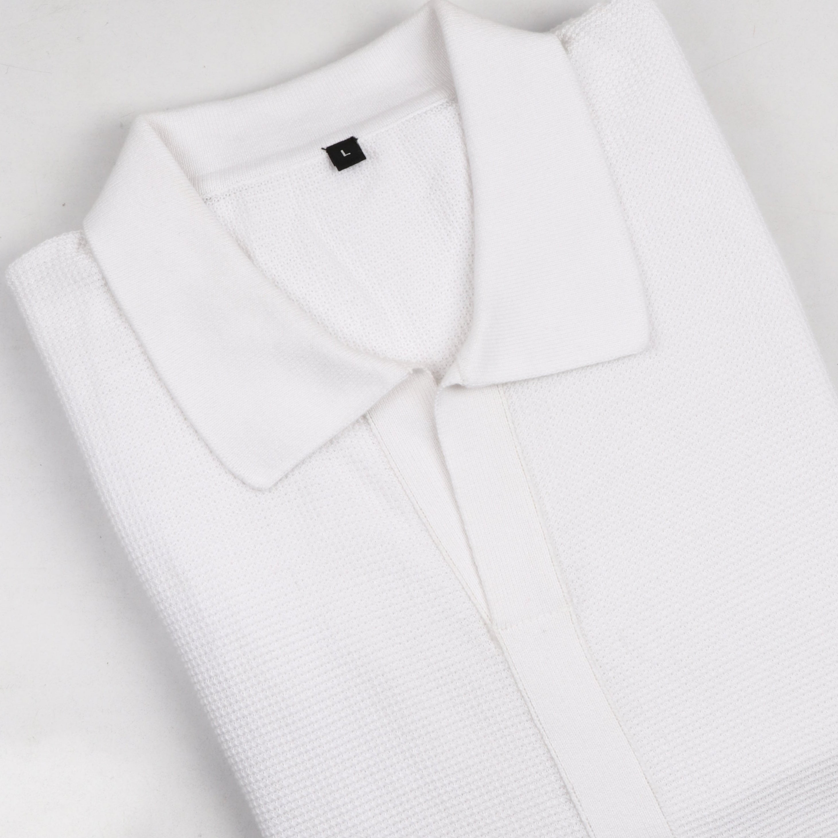MINIMALIST, TEXTURED PINNACLE POLO